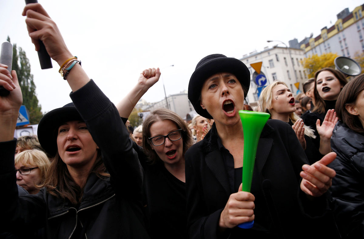Woman shout slogans as they gather in an abortion rights campaigners’ demonstration to protest against plans for a total ban on abortion in front of the ruling party Law and Justice (PiS) headquarters in Warsaw