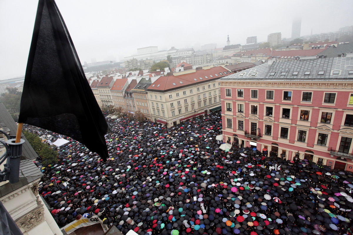 Thousands of people gather during an abortion rights campaigners’ demonstration to protest against plans for a total ban on abortion in front of the Royal Castle in Warsaw