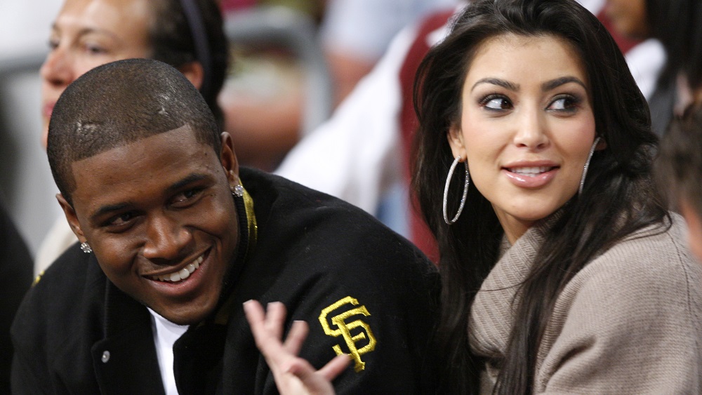 New Orleans Saints football player Reggie Bush and his girlfriend Kim Kardashian watch the Los Angeles Lakers during NBA game in Los Angeles