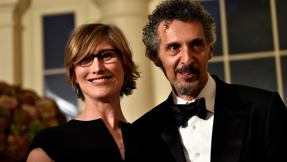 Actor Turturro and his wife arrive for a State Dinner honoring Italian Prime Minister Matteo Renzi at the White House in Washington