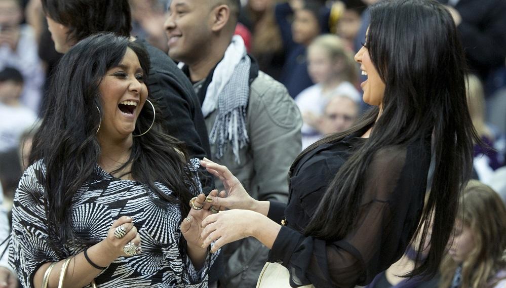 U.S. reality television personality “Snooki” Polizzi meets with television celebrity Kardashian during NBA basketball game between Dallas Mavericks and New Jersey Nets in Newark
