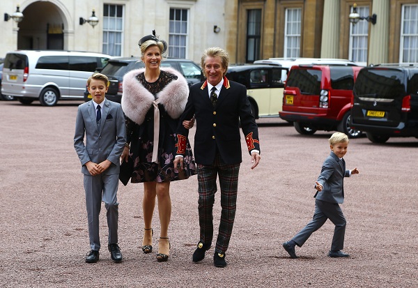 Singer Rod Stewart arrives at Buckingham Palace with his wife, Penny Lancaster and children Alastair and Aiden, to receive a knighthood, in London