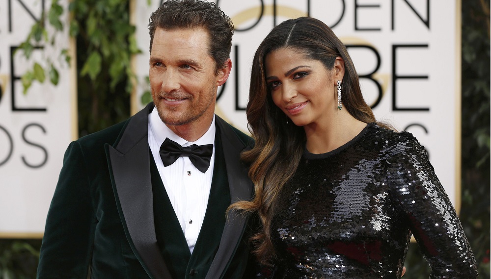 Actor McConaughey arrives with Alves at the 71st annual Golden Globe Awards in Beverly Hills