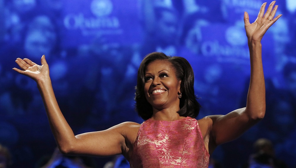 U.S. first lady Michelle Obama waves before addressing the first session of the Democratic National Convention in Charlotte