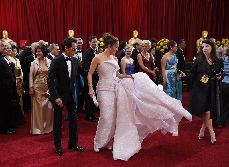 Jennifer Lopez picks up the train of her dress on the red carpet at the 82nd Academy Awards in Hollywood