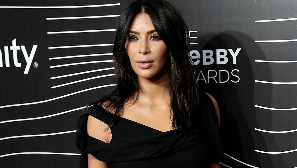Actress Kim Kardashian West poses as she arrives for the 20th Annual Webby Awards in Manhattan, New York