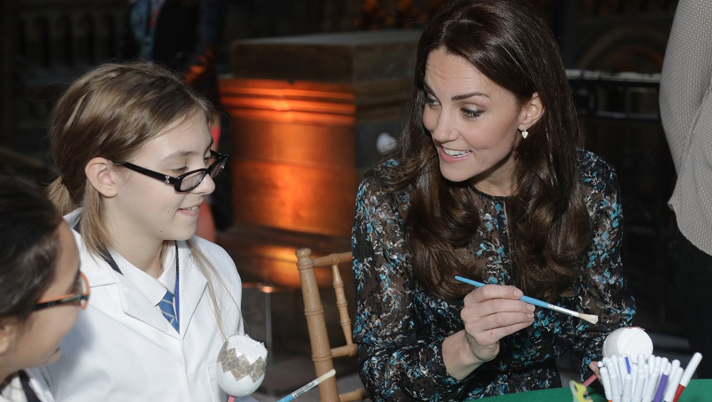 Britain’s Catherine, Duchess of Cambridge makes a dinosaur egg whilst attending a children’s tea party  to celebrate Dippy the Diplodocus’s time in Hintze Hall with pupils from Oakington Manor Primary School, at the Natural History Museum in London