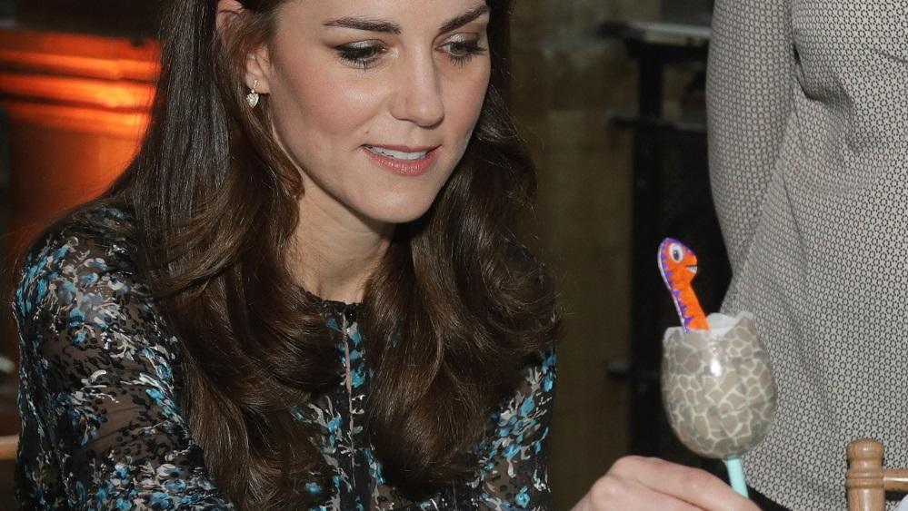 Britain’s Catherine, Duchess of Cambridge makes a dinosaur egg whilst attending a children’s tea party to celebrate Dippy the Diplodocus’s time in Hintze Hall with pupils from Oakington Manor Primary School, at the Natural History Museum in London