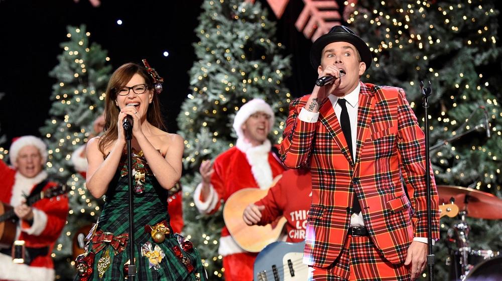 Lisa Loeb and Mark McGrath perform before the 85th annual Hollywood Christmas Parade in Los Angeles
