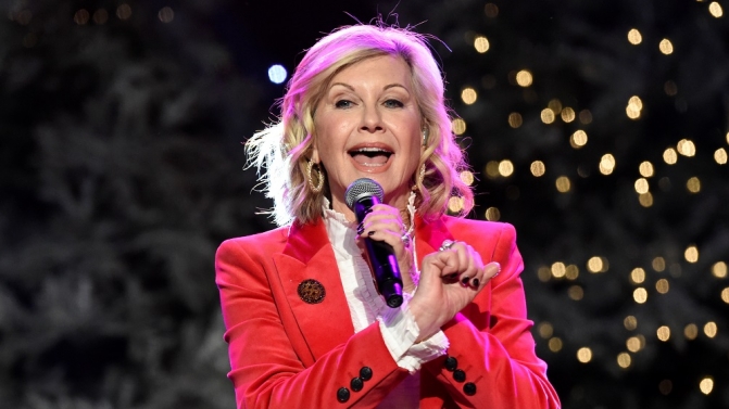 Olivia Newton-John performs before the 85th annual Hollywood Christmas Parade in Los Angeles