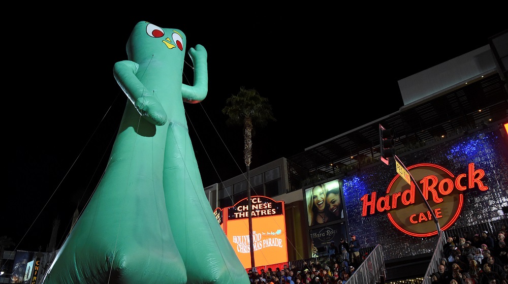 A large inflatable Gumbie character is pulled along in the 85th annual Hollywood ChristmasParade in Los Angeles