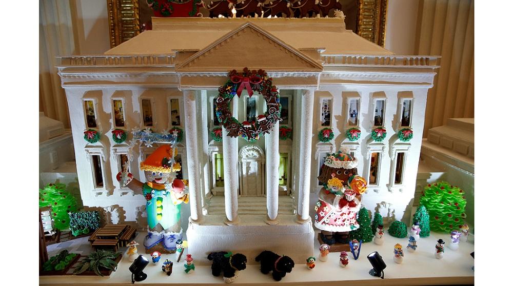 The gingerbread house is on display in the State Dining Room during a holiday decor preview at the White House in Washington