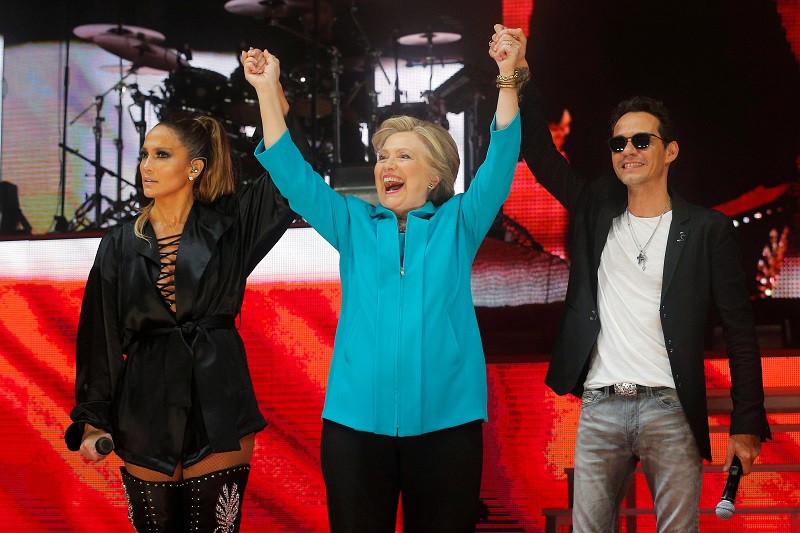 U.S. Democratic presidential nominee Hillary Clinton joins performers Jennifer Lopez and Marc Anthony at a campaign concert in Miami