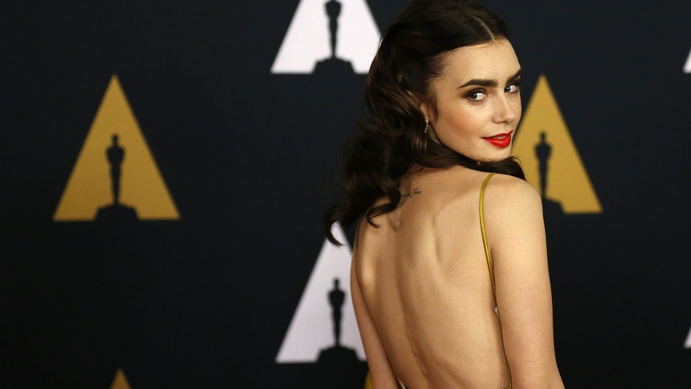 Actress Lily Collins arrives at the 8th Annual Governors Awards in Los Angeles