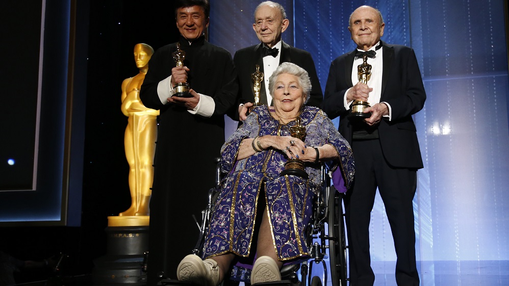 Honorary Award winners Chan, Wiseman, Coates and Stalmaster pose on stage at the 8th Annual Governors Awards in Los Angeles