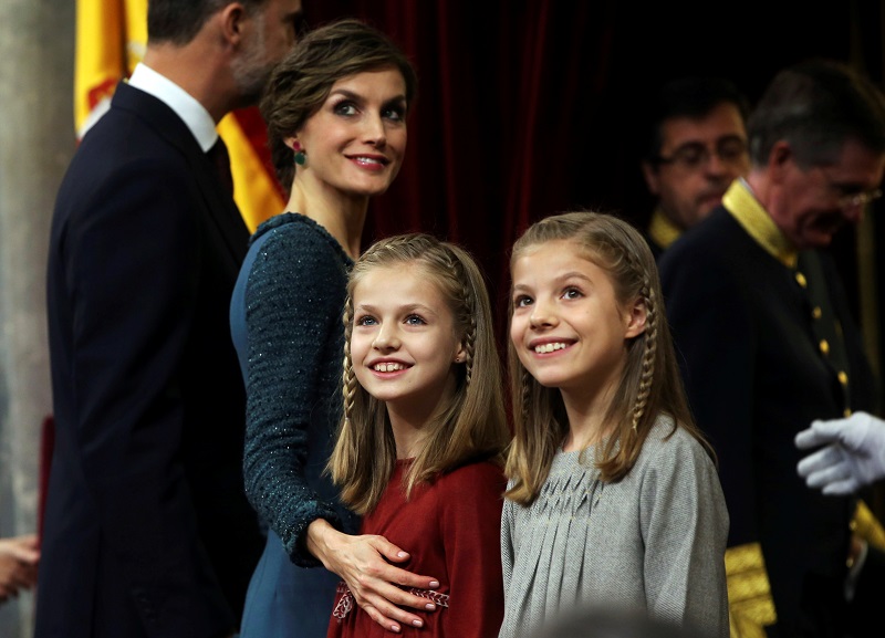 Queen Letizia of Spain, Princess Leonor, and Princess Sofia smile as they leave after taking part in a ceremony to inaugurate the XII Legislature at Spain’s Parliament in Madrid