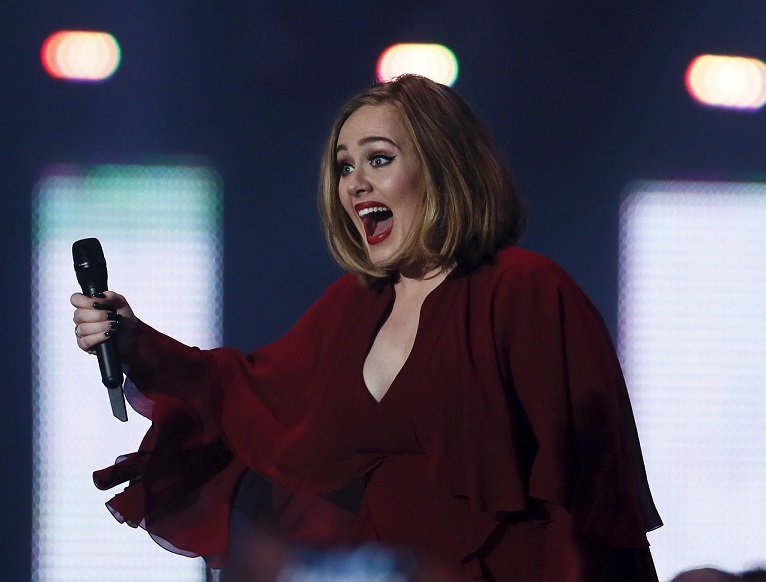 Adele arrives to accept the award for best British single at the BRIT Awards at the O2 arena in London
