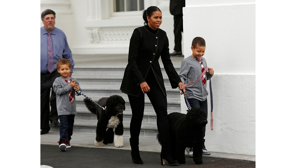 First lady Michelle Obama and nephews welcome White House Christmas tree in Washington