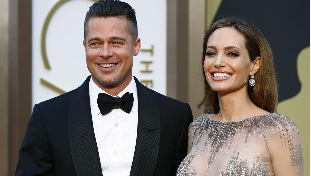 File photo of actor Brad Pitt and actress Angelina Jolie arriving at the 86th Academy Awards in Hollywood