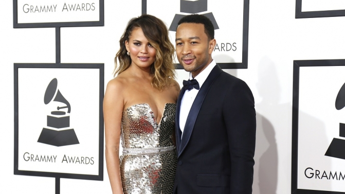 John Legend and his wife Chrissy Teigen arrive at the 56th annual Grammy Awards in Los Angeles
