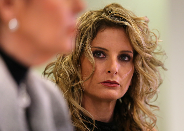 Summer Zervos listens as her attorney Gloria Allred speaks during a news conference announcing the filing of a lawsuit against President-elect Donald Trump in  Los Angeles, California
