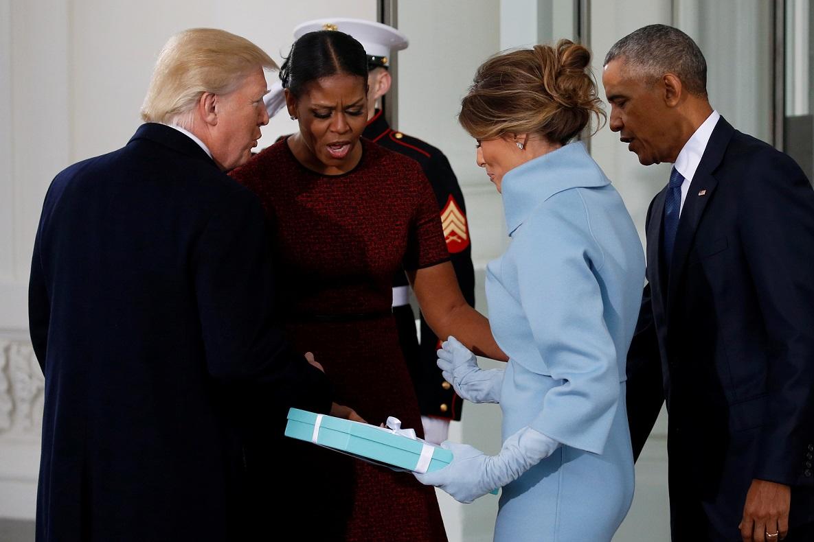 Trump and his wife present a gift to the Obamas as the Trumps arrive for tea before the inauguration at the White House in Washington