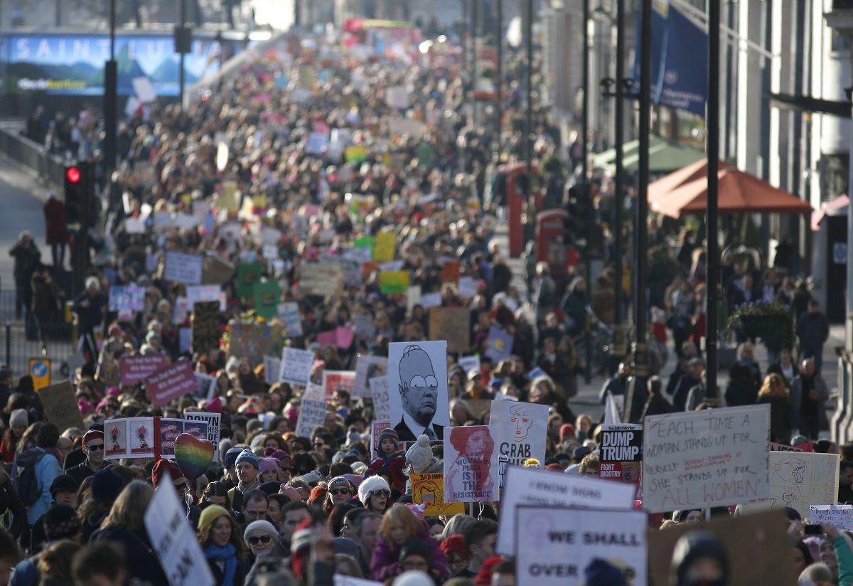 Protesters take part in the Women’s March on London, as they walk from the American Embassy to Trafalgar Square, in central London