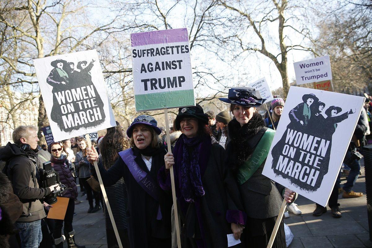 Protesters carrying banners take part in the Women’s March on London, as they walk from the American Embassy to Trafalgar Square, in central London