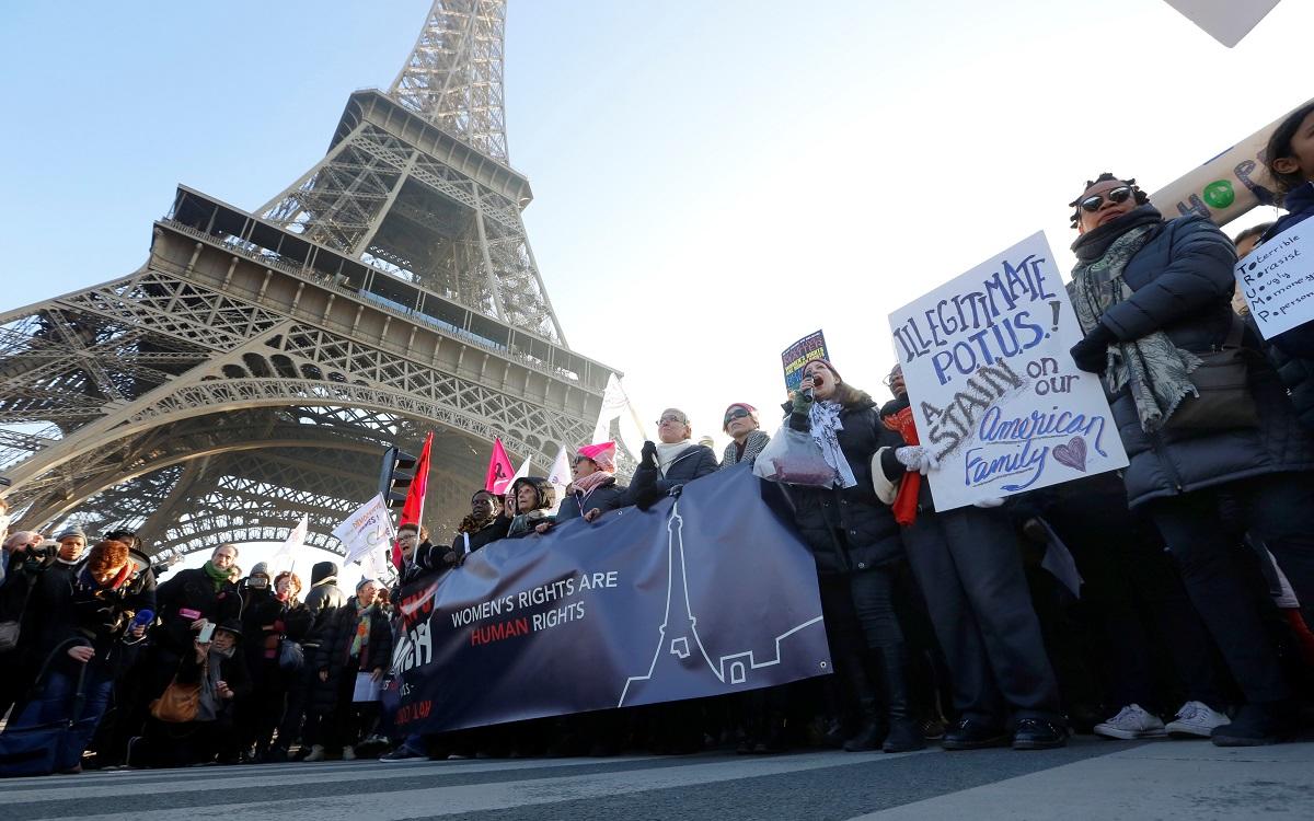 Protesters take part in the Women’s March in Paris