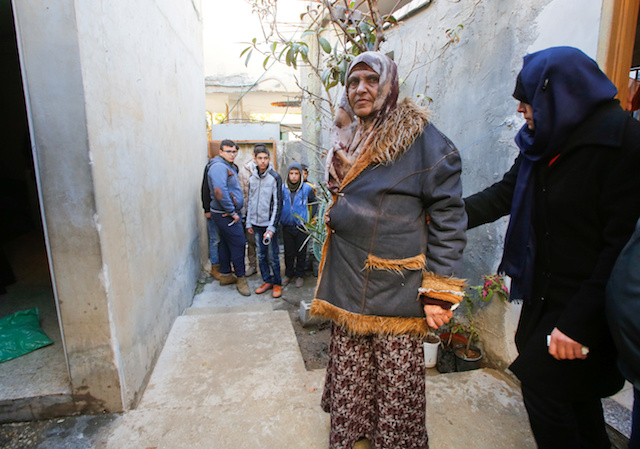 The mother of Palestinian Mohammad Al-Salahe, 32, stands at her house in Al-Faraa refugee camp near the West Bank city of Nablus