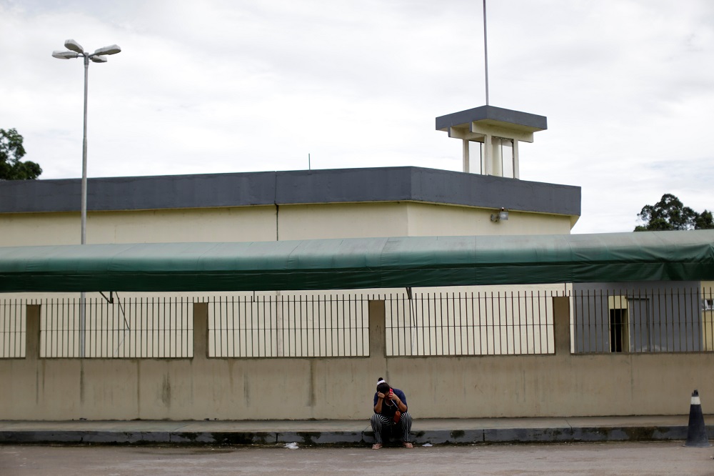 A relative of a prisoner is seen in front of Anisio Jobim prison in Manaus, Brazil