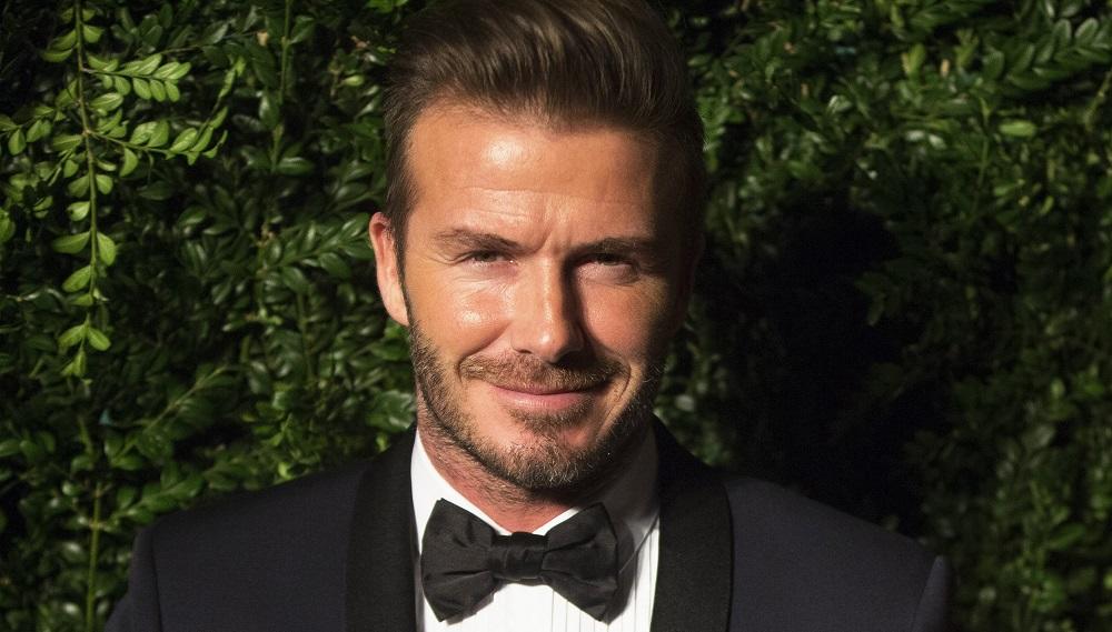 Former British soccer player Beckham smiles at the Evening Standard Theatre awards in London