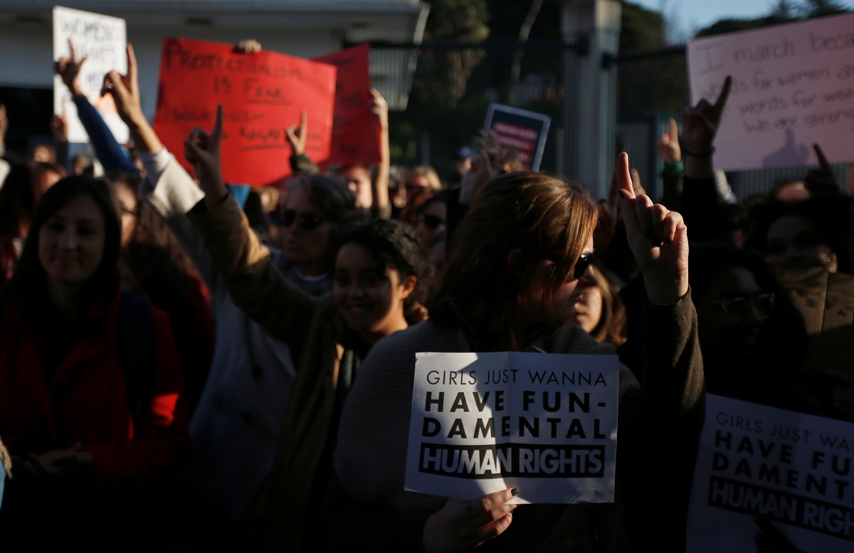 Demonstrators protest against U.S. President Donald Trump next to the U.S. embassy during the Women’s March in Lisbon