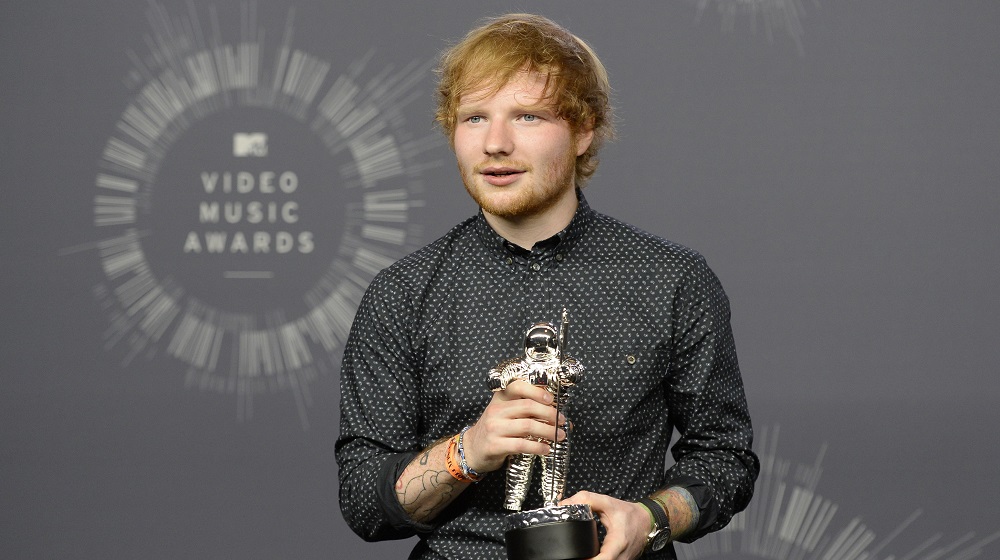 Singer Ed Sheeran poses backstage after winning the award for best male video for 