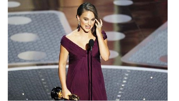 Natalie Portman accepts her Oscar for best actress for her role in “Black Swan” during the 83rd Academy Awards in Hollywood