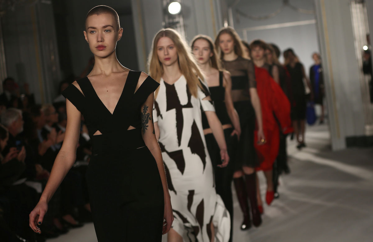 Models present creations at the Jasper Conran catwalk show during London Fashion Week in London