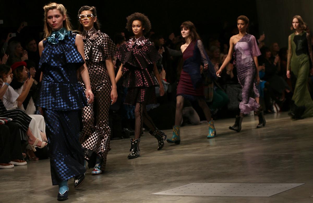 Models present creations at the House of Holland catwalk show during London Fashion Week in London