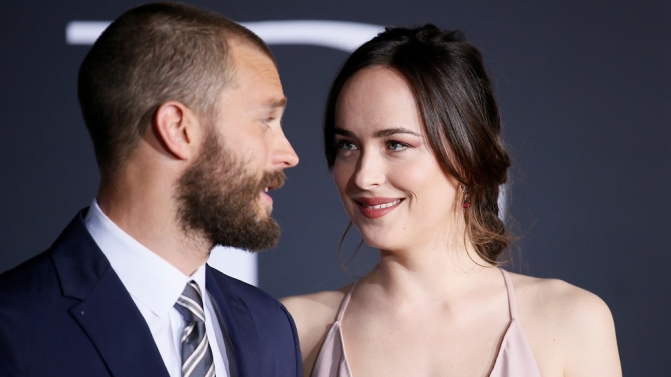 Cast members Jamie Dornan and Dakota Johnson pose at the premiere of the film “Fifty Shades Darker” in Los Angeles, California