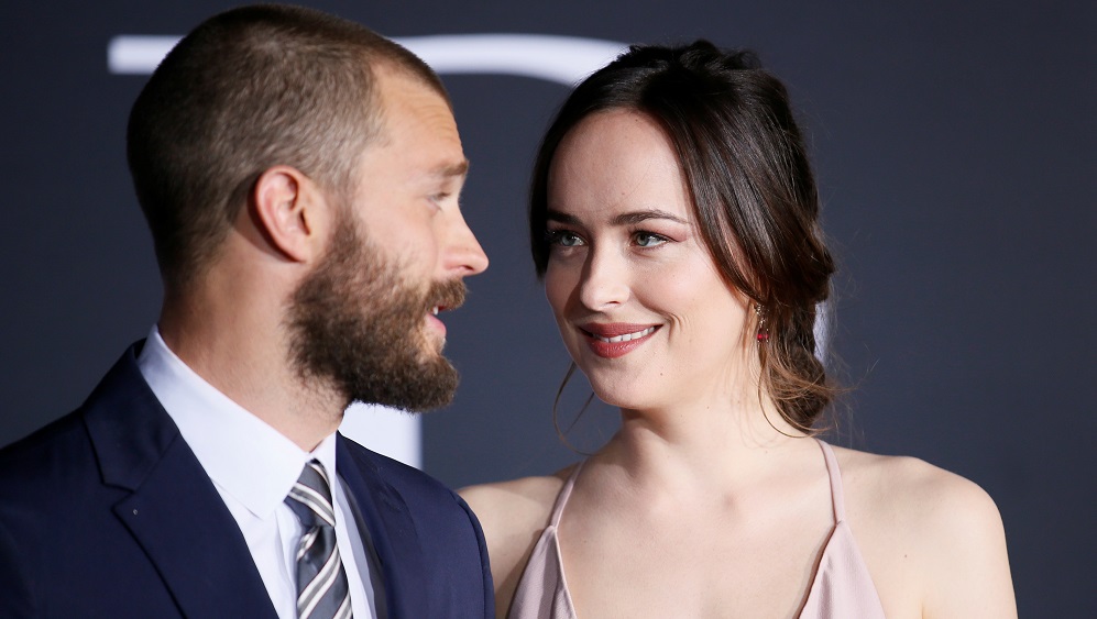 Cast members Jamie Dornan and Dakota Johnson pose at the premiere of the film “Fifty Shades Darker” in Los Angeles, California