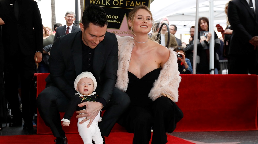 Musician Levine with his wife Behati Prinsloo and daughter Dusty Rose pose by his star after it was unveiled on the Hollywood Walk of Fame in the Hollywood neighborhood of Los Angeles