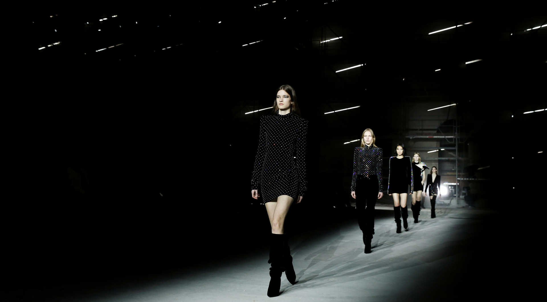 Models present creations by designer Anthony Vaccarello as part of his Autumn/Winter 2017/18 women’s ready-to-wear collection for fashion house Saint Laurent during Fashion Week in Paris