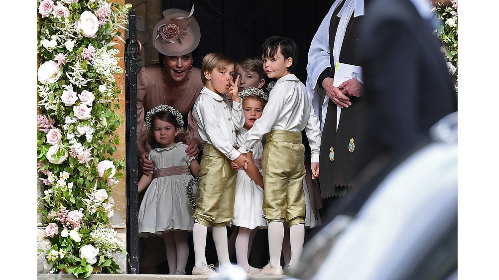 Britain’s Catherine, Duchess of Cambridge, stands with her daughter Princess Charlotte, as they arrive for the wedding of Pippa Middleton and James Matthews at St Mark’s Church in Englefield, west of London
