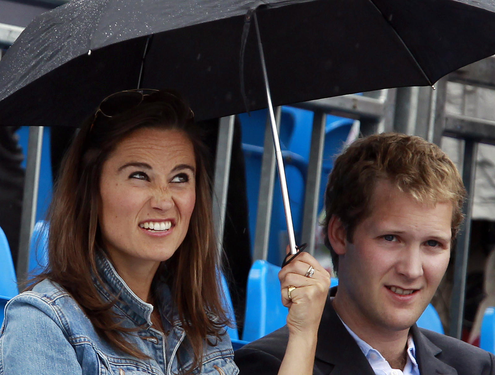 Pippa Middleton reacts before a rain break at the Queen’s Club Championships in west London