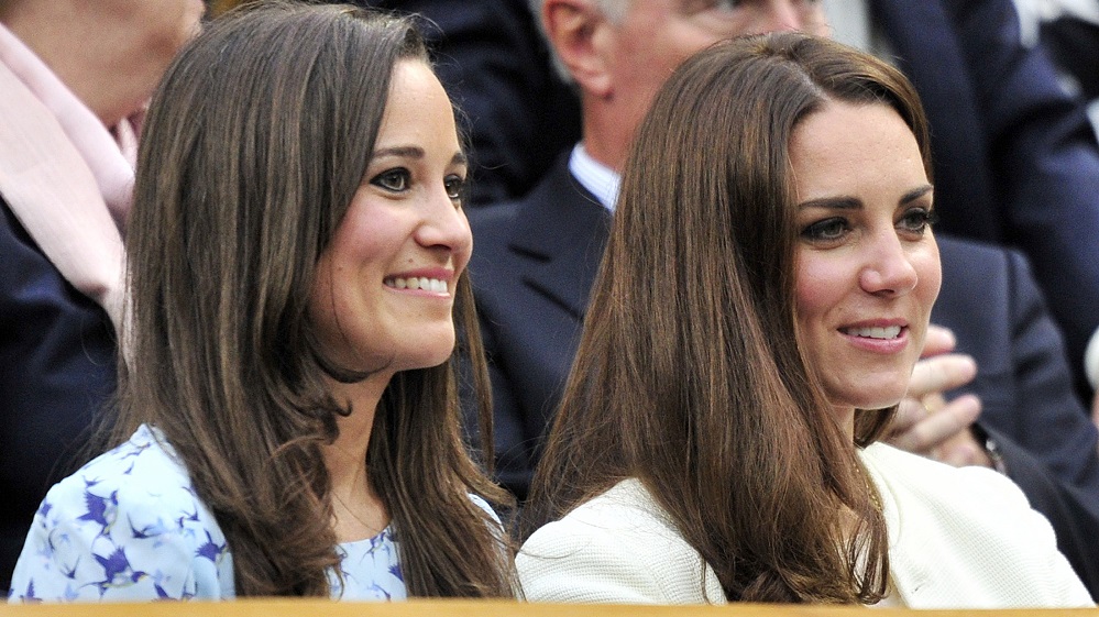 Britain’s Catherine, Duchess of Cambridge sits with her sister Pippa Middleton on Centre Court at the Wimbledon Tennis Championships in London