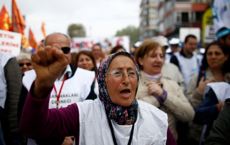 A woman shouts slogans as people arrive to attend a May Day rally in Istanbul