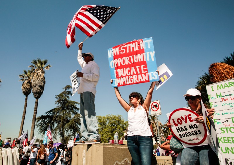 People participate in a May Day protest march in Los Angeles
