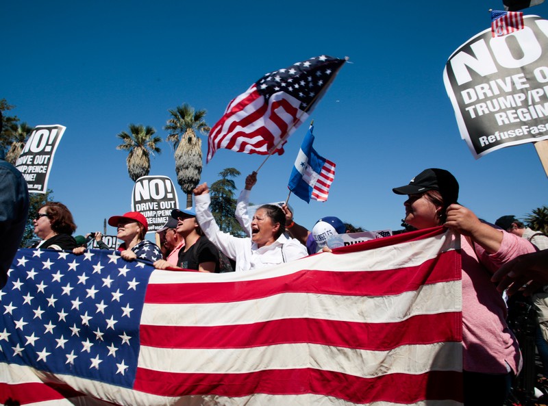 People participate in a May Day protest march in Los Angeles