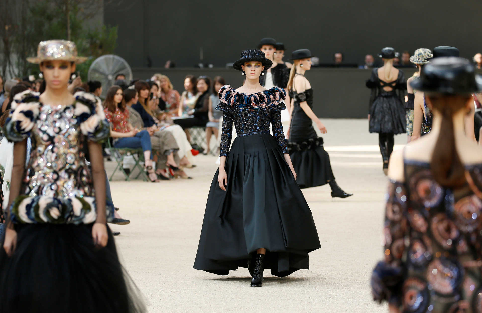 Models present creations by German designer Karl Lagerfeld as part of his Haute Couture Fall/Winter 2017/2018 collection for fashion house Chanel in Paris
