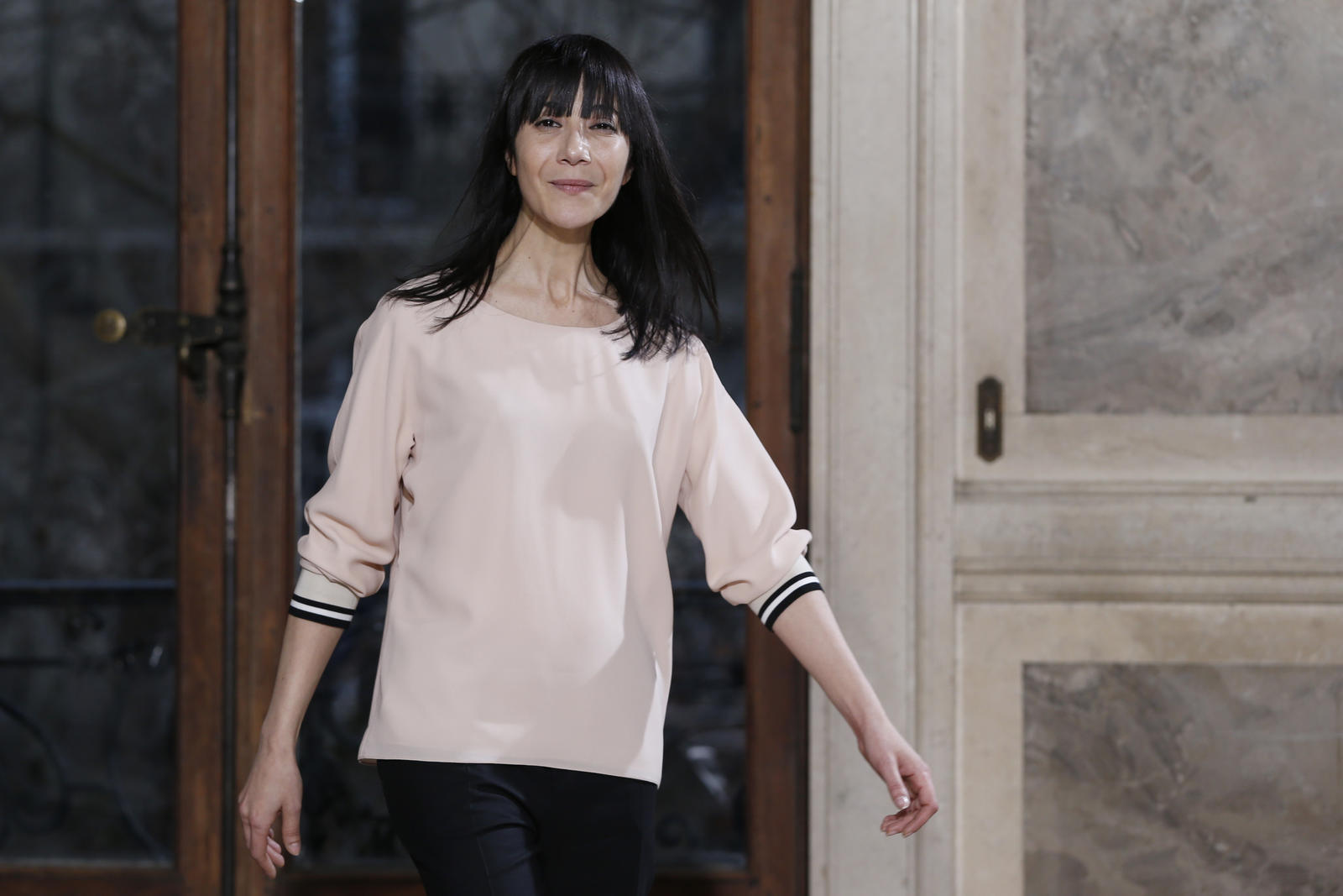 French designer Bouchra Jarrar appears at the end of her Haute Couture Spring/Summer 2014 fashion collection in Paris