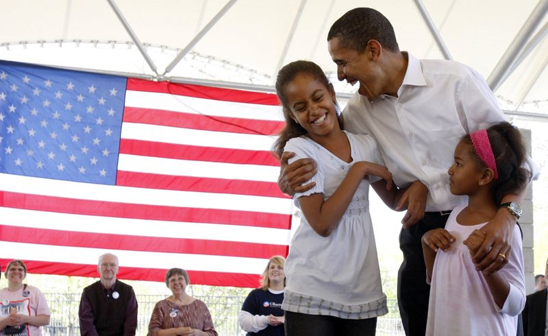 U.S. Presidential candidate Obama shares a moment with his daughters during a picnic in Fort Wayne